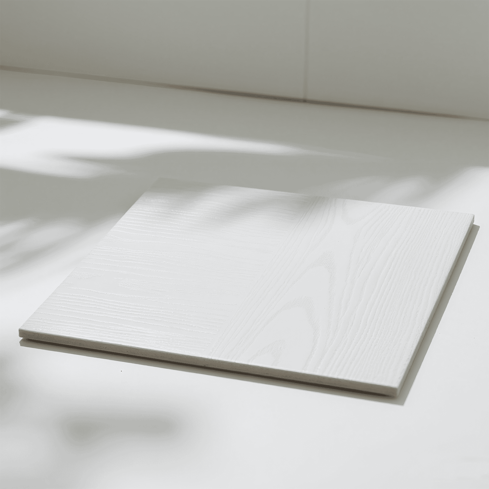 White matte tile flooring in a bright coastal-style room with natural sunlight