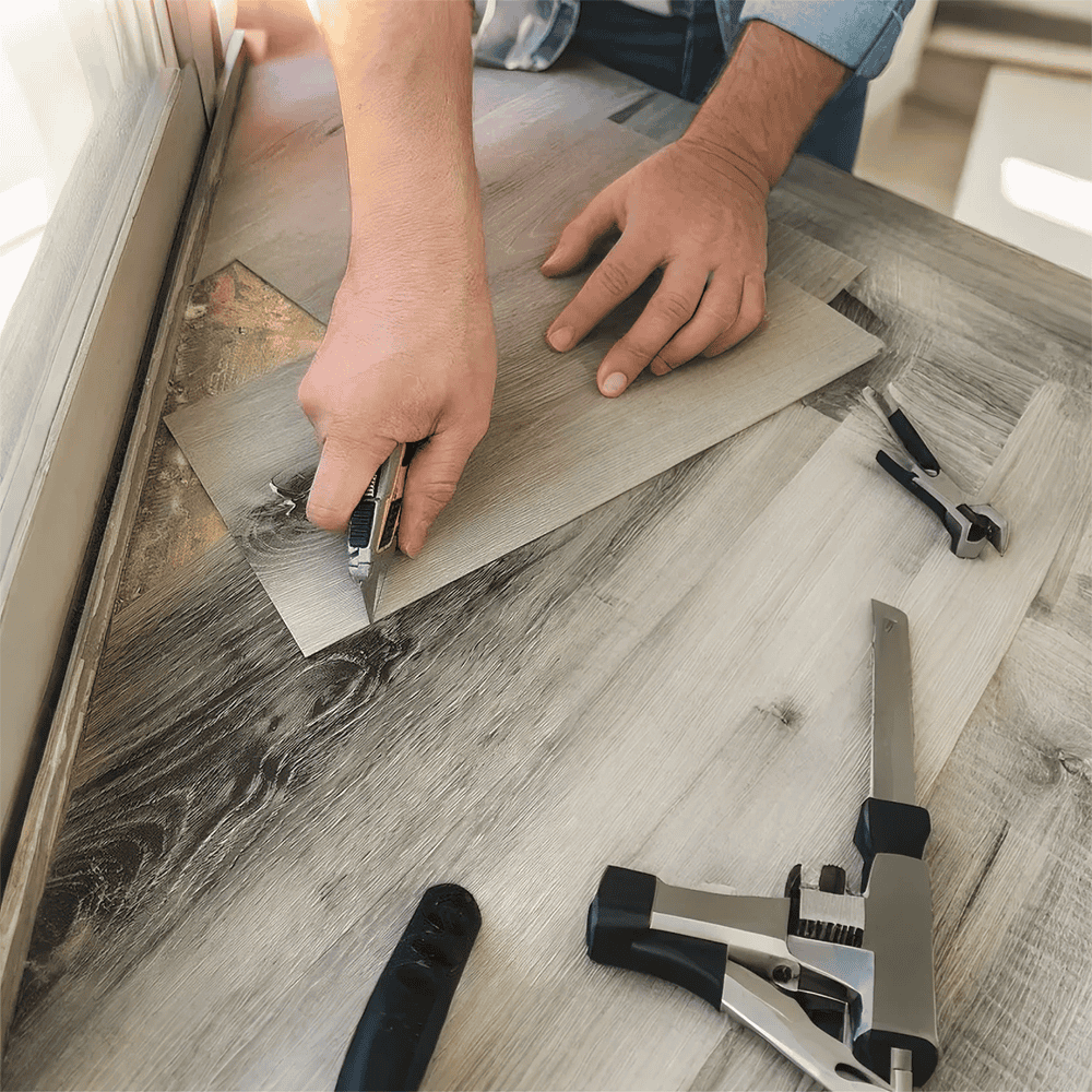Cutting LVT vinyl with scissors for tight space fit