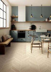 A modern kitchen renovation featuring VividCozy’s light-tone herringbone wood-look tiles. Scandinavian-inspired cabinetry and natural light complete the space.