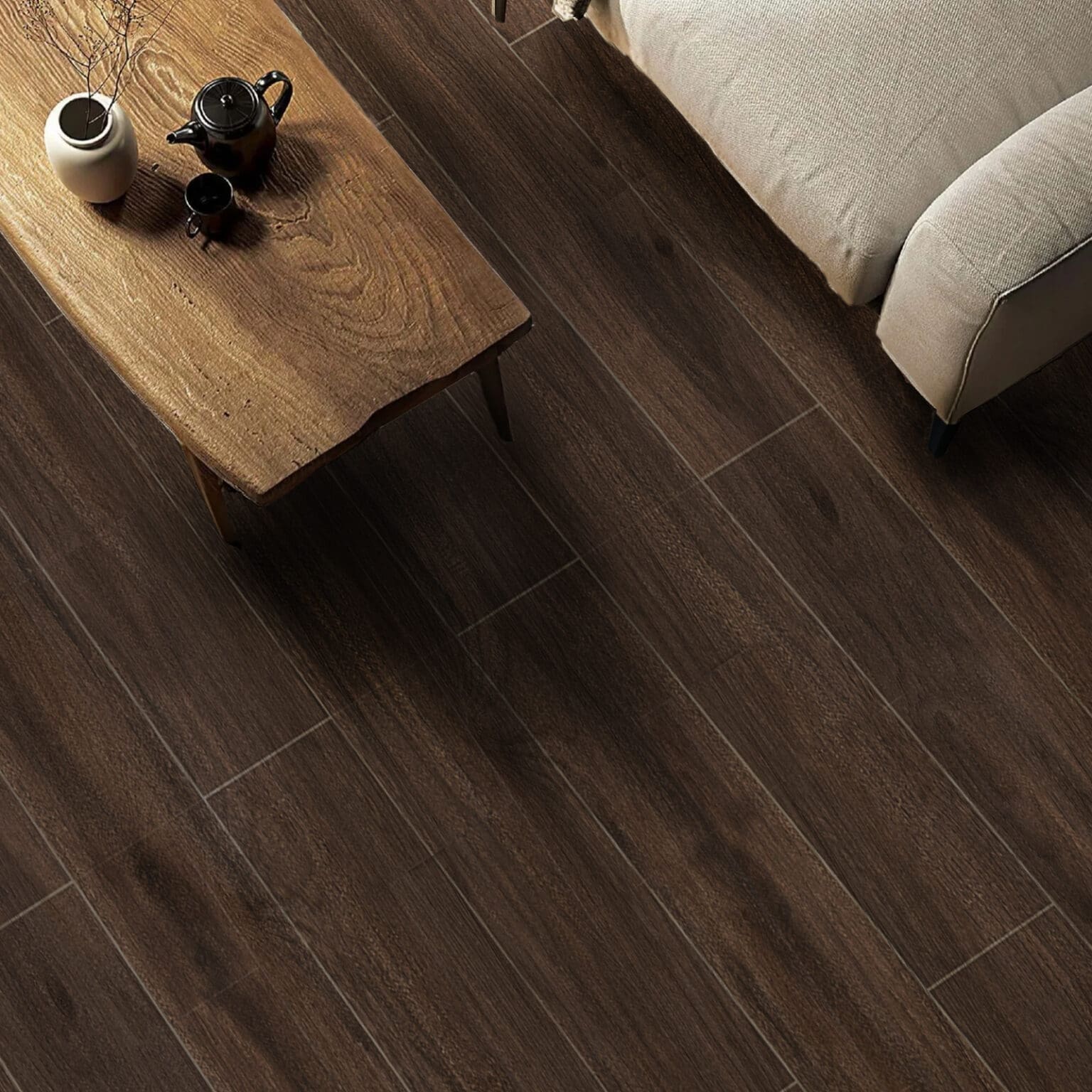 Scandinavian Espresso Brown Wood Look Tile on a living room floor, embracing the warmth of Scandinavian design. This 100% waterproof porcelain tile offers timeless elegance, resisting scratches and stains for a beautiful, worry-free lifestyle.
