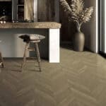Italian Minimalism Smoked Brown Wood Look Tile on a kitchen floor, creating a warm, luxurious atmosphere. This 100% waterproof porcelain tile offers unmatched durability, resisting scratches and stains for a sophisticated, worry-free minimalist design.