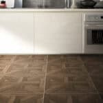 Classical Stately Dark Walnut Wood Look Tile in a modern kitchen, creating a grand, inviting atmosphere with its deep, rich tones. This 100% waterproof porcelain tile offers unmatched durability, resisting scratches and stains for a worry-free lifestyle.