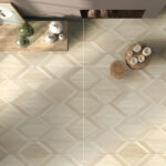 Light Luxury Beige White Wood Color Wood Look Tile on a living room floor, creating a bright, airy, sophisticated atmosphere. This 100% waterproof porcelain tile offers unmatched durability, resisting scratches and stains for a worry-free, serene luxury.