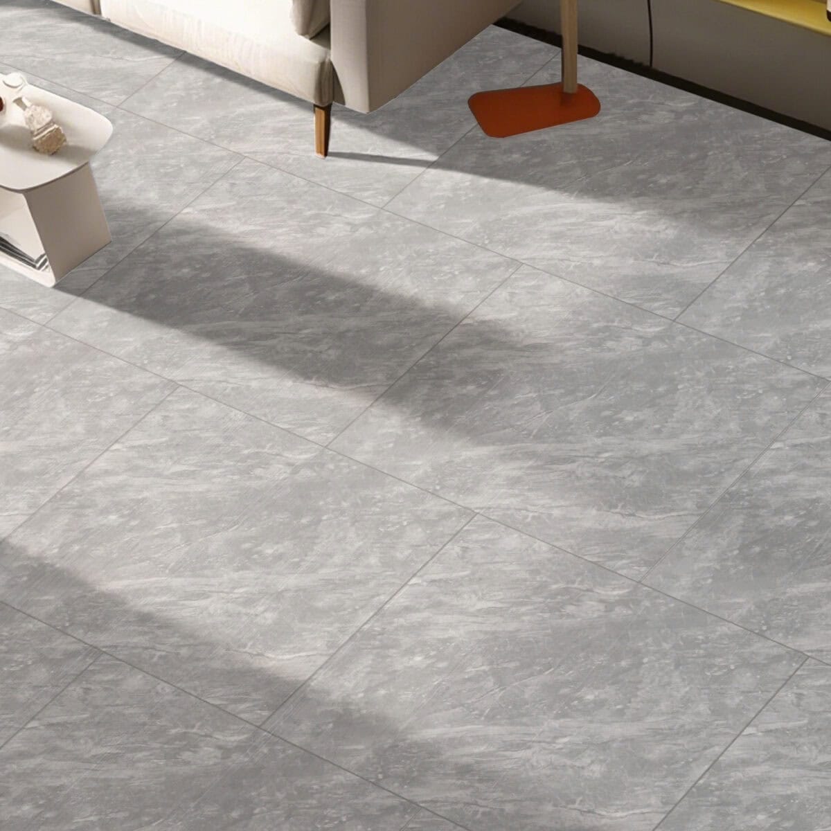 Modern Minimalist Pewter Slate Stock Look Vinyl Flooring in a serene living room, brightening the space with its light-grey palette and organic texture. This 100% waterproof vinyl offers the refined aesthetic of natural slate and superior protection against scratches, stains, and dents for a practical, high-end style.