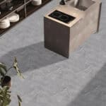Timeless Classic Stormy Gray Stone Look Click Lock Vinyl Flooring SPC in a modern kitchen, offering a sophisticated backdrop with its versatile gray tones. This 100% waterproof, DIY-friendly SPC flooring resists scratches, stains, and dents, ideal for effortless elegance.