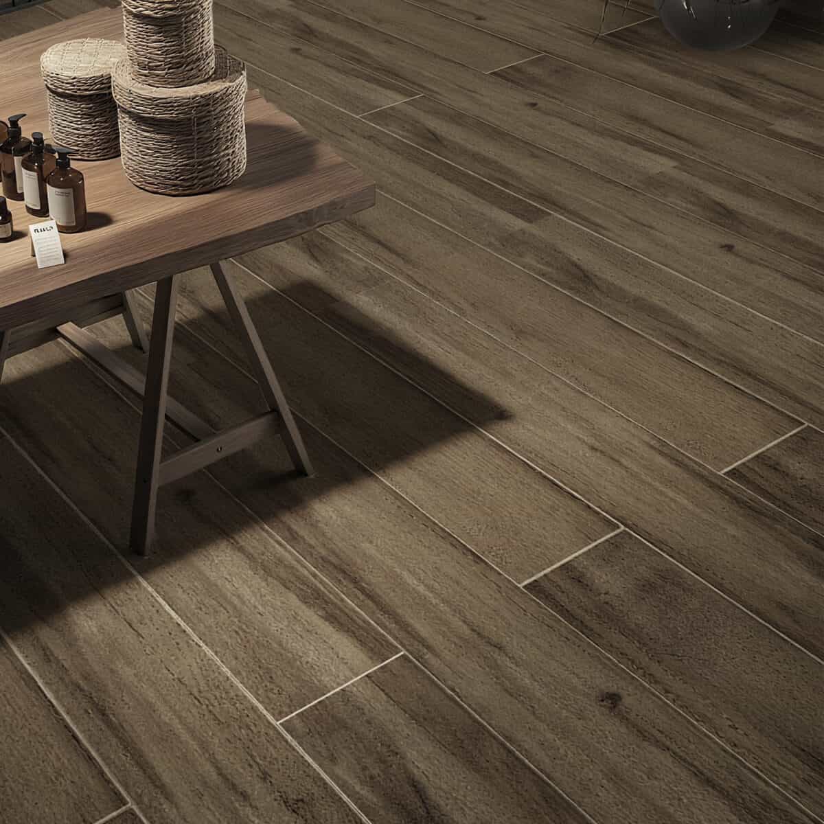 Industrial Smoked Brown Wood Look Tile on a kitchen floor, creating a powerful, sophisticated industrial atmosphere. This 100% waterproof porcelain tile offers unmatched durability, resisting scratches and stains for a worry-free lifestyle.
