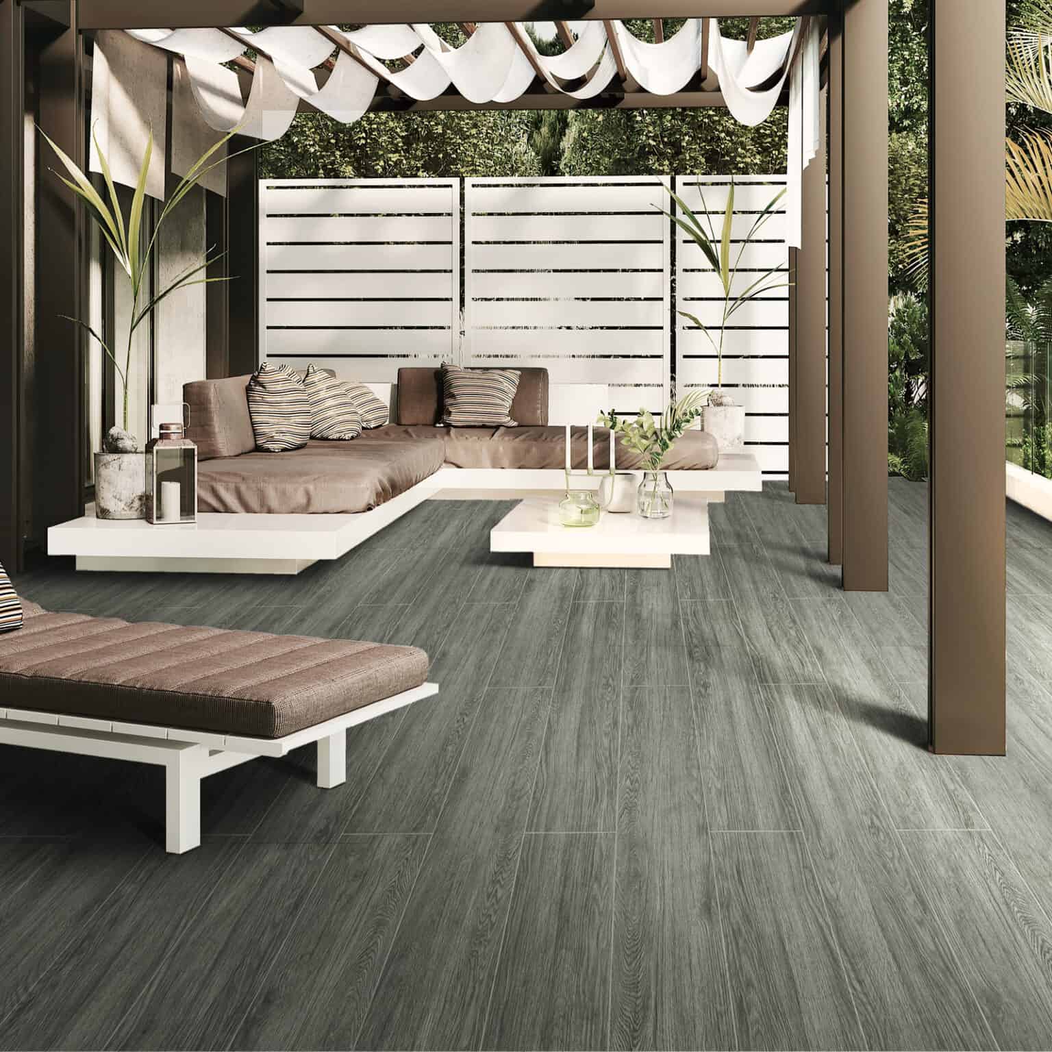 Modern Minimalist Charcoal Gray Wood Look Tile in a sophisticated outdoor living space, creating a bold backdrop with its deep charcoal tones. This 100% waterproof porcelain tile offers superior durability, resisting scratches and stains for a worry-free, elegant outdoor design.