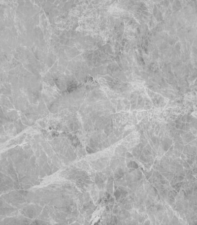 Close-up of a Serene Sanctuary Athens Gray Stock Look Vinyl Flooring tile, showcasing its soft, cloud-like gray tones and subtle veining that evoke genuine marble. This durable vinyl is 100% waterproof, resisting scratches, stains, and dents, perfect for a tranquil, elegant home.