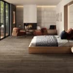Rustic Modern Weathered Oak Wood Look Tile on a bedroom floor, creating a bright, open, and sophisticated atmosphere. This 100% waterproof porcelain tile offers unmatched durability, resisting scratches and stains for a worry-free lifestyle.