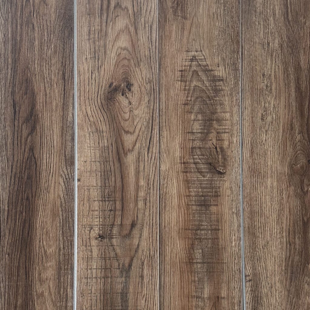 Real photo full view of Rustic Tawny Oak SPC flooring, highlighting its detailed knots and rich wood grain character.