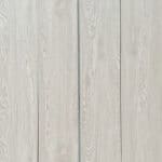 A seamless, full-frame view of Modern Whitewash Oak resilient wood-grain planks.