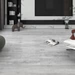 Superior Modern Silverwood SPC flooring in a chic living room with a marble-accented media center and modern decor.