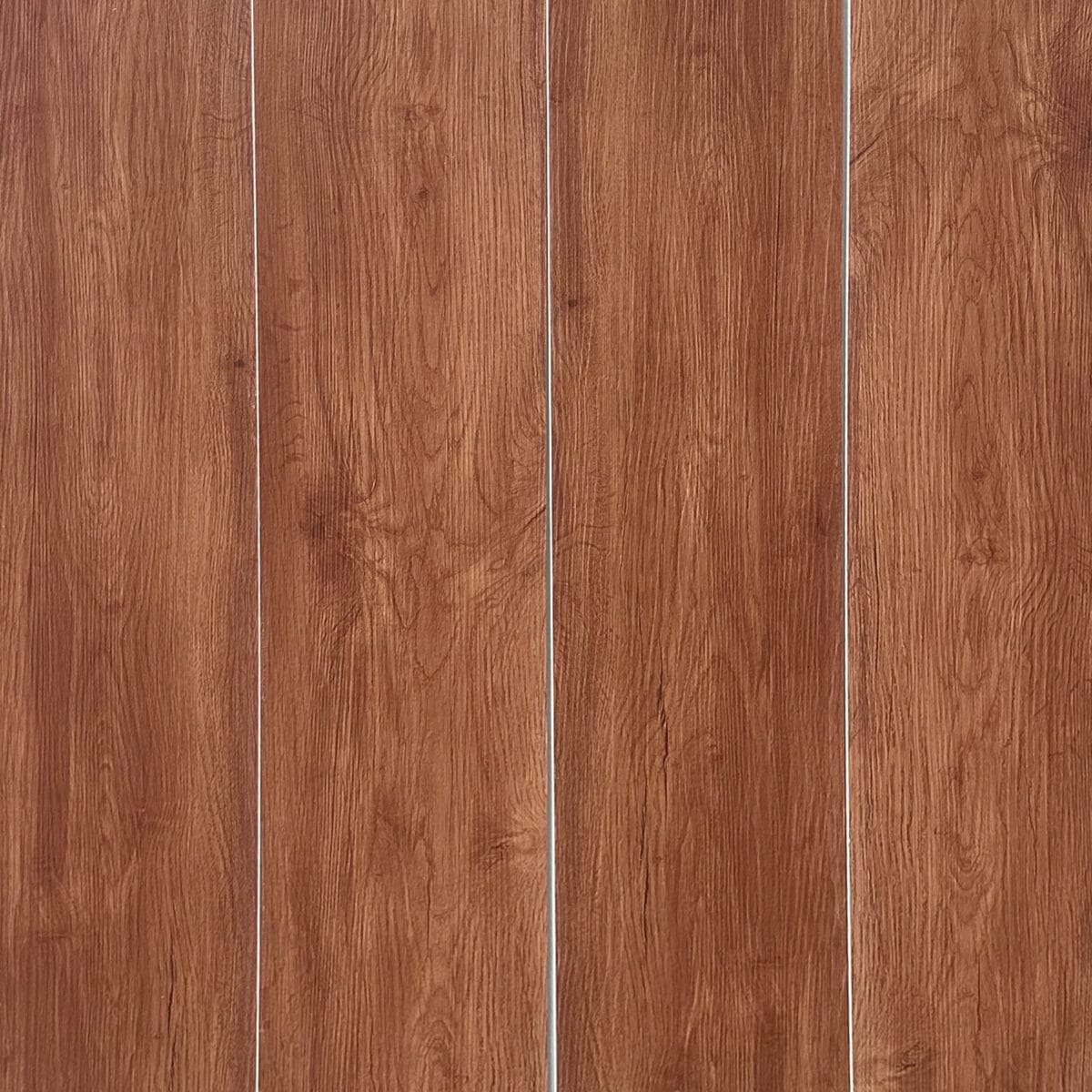 Full view of Contemporary Warm Teak SPC flooring planks showcasing their warm, reddish-brown color and consistent grain.