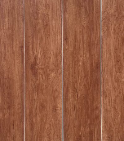 Full view of Contemporary Warm Teak SPC flooring planks showcasing their warm, reddish-brown color and consistent grain.