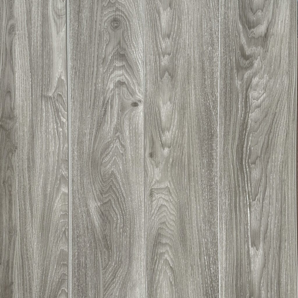 Full top-down view of Modern Ash Gray SPC flooring showcasing the seamless plank installation and realistic wood grain pattern.