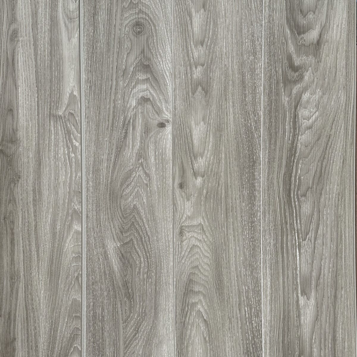 Full top-down view of Modern Ash Gray SPC flooring showcasing the seamless plank installation and realistic wood grain pattern.