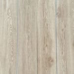 Real-world photograph of Serene Coastal Beige Oak SPC planks laid together, showcasing their seamless, natural wood appearance.