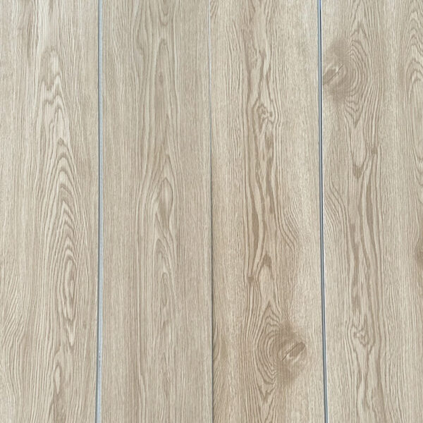 Real-world photograph of Serene Coastal Beige Oak SPC planks laid together, showcasing their seamless, natural wood appearance.