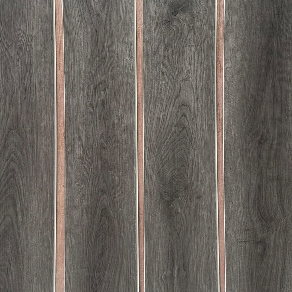Real photo of Chic Charcoal Oak SPC planks laid out, showing the deep color and consistent grain for a seamless look.