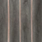 Real photo of Chic Charcoal Oak SPC planks laid out, showing the deep color and consistent grain for a seamless look.