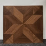 Real photo of a single American Vintage Coffee Brown Wood Look Tile, showcasing its intricate geometric parquet pattern and rich wood grain.