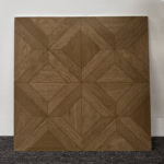 Real photo of a single Artistic Parquet Medium Walnut Wood Look Tile, showcasing its detailed geometric design and warm wood grain.