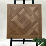 Real photo of a single Classical Luxury Mixed Walnut Wood Look Tile, showcasing its intricate parquet design and rich wood grain tones.