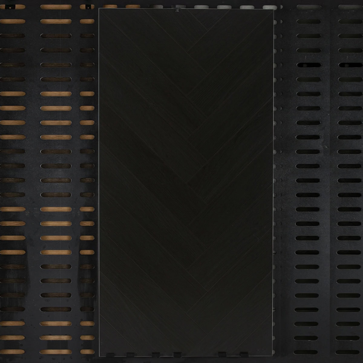 Real photo of a single Dramatic Noir Charcoal Black Wood Look Tile, showcasing its subtle herringbone pattern and deep, blackened wood grain.