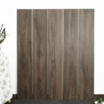 Real photo of Authentic Rustic Modern Weathered Oak Wood Look Tile planks, showcasing their realistic aged wood grain and rich texture.