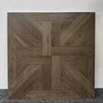 Real photo of a single Stately Dark Walnut Wood Look Tile, showcasing its intricate parquet pattern and rich, deep wood grain tones.