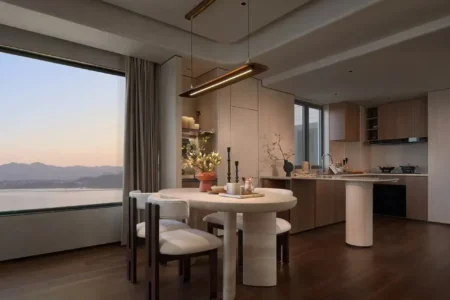 Kitchen–dining space with lake view, warm wood-look SPC vinyl flooring and porcelain tile accents — vividcozytile, Zhongshan