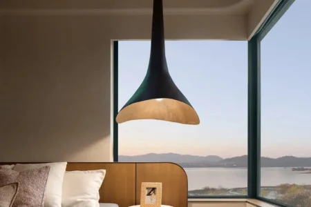 Bedroom corner by bay window, seamless wood-tone SPC vinyl floor for a calm retreat — vividcozytile Blue City Xiangshan